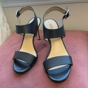 Michael Kors ankle strap heels, size 7
Signs of wear bottom right shoe. See pics